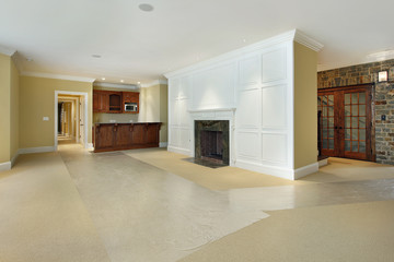 Basement with fireplace and bar