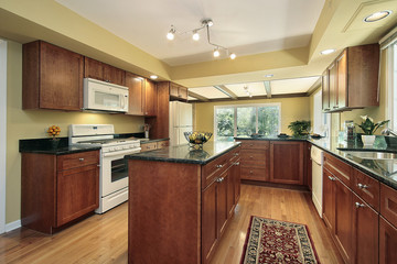 Kitchen with black granite counters