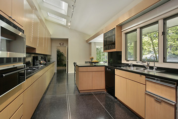 Kitchen with black speckled flooring