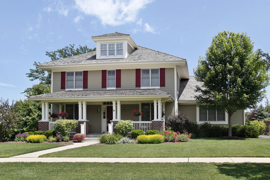 Suburban home with red shutters