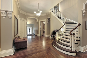 Foyer with curved staircase - Powered by Adobe