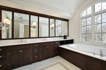 Master bath with dark cabinetry