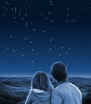 Couple under starry sky