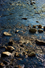 Running water and stone at a river