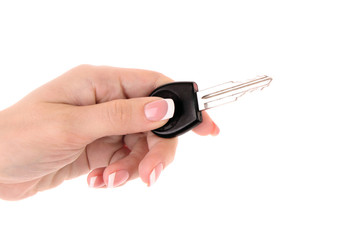 Woman hand with keys isolated on white