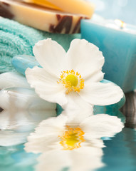 Spa setting with flower and blue candle