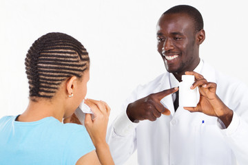friendly african pharmacist helping sick customer