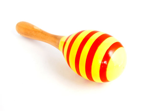 yellow wood maracas with red stripe isolated