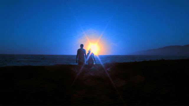 Cuple walks into sunset fast motion - HD
