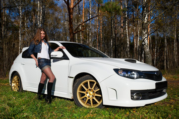 Beautiful girl and stylish white sports car