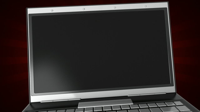 Opening a laptop with festive ribbons flying from the screen