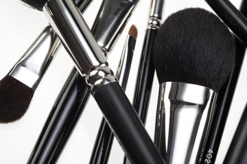 detail of a random composition with make-up brushes