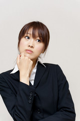 a portrait of young business woman thinking