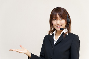 a portrait of young business woman with haedset