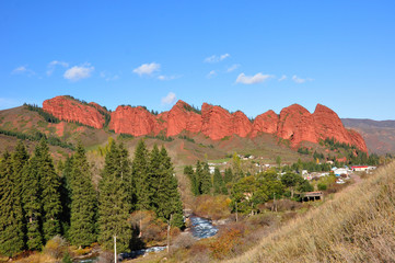 Red rocks Seven-bulls in picturesque gorge Dzhety-Oguz
