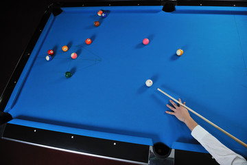 young man play pro billiard game