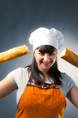 woman cook breaking a french bread
