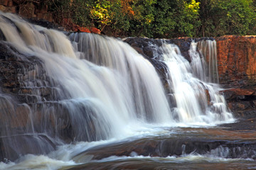 Fototapeta na wymiar Tropical Tadtone waterfall in rain forest