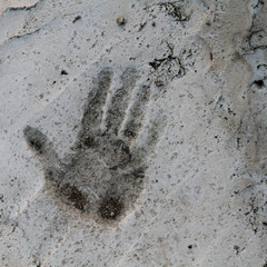 grungy hand print in concrete floor