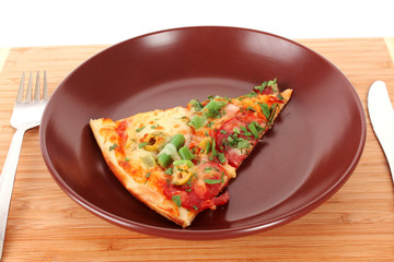 Pizza on plate with fork and knife