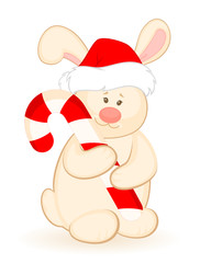 little toy bunny in the suit of Santa Claus with gift