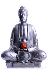 Meditating Buddha with red flower