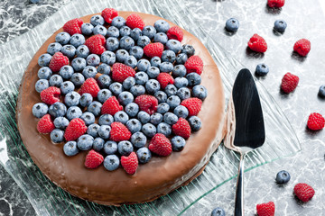 chocolate cake with raspberries and blueberries