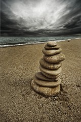 Fototapeta na wymiar Stone tower on the beach