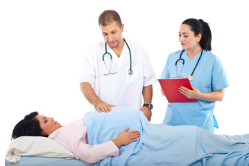 Fototapeta premium Doctor examine pregnant belly