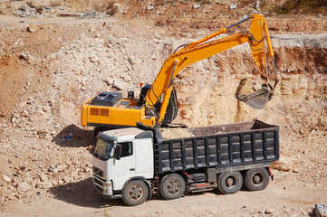 excavator loading dumper truck with sand