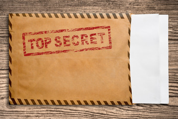 Envelope with top secret stamp and blank papers. - obrazy, fototapety, plakaty