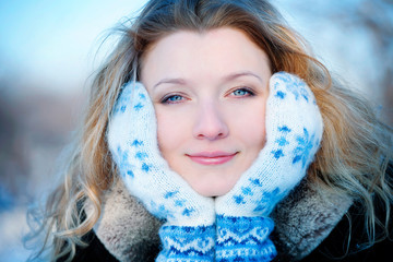 Closeup portrait of beautiful young girl in winter day