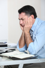 Businessman in the office working hard on project