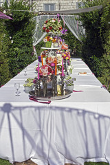 Beautiful floral table setting for wedding in a garden