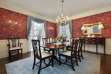 Dining room with red floral wallpaper