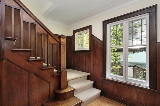 Foyer with wood paneling