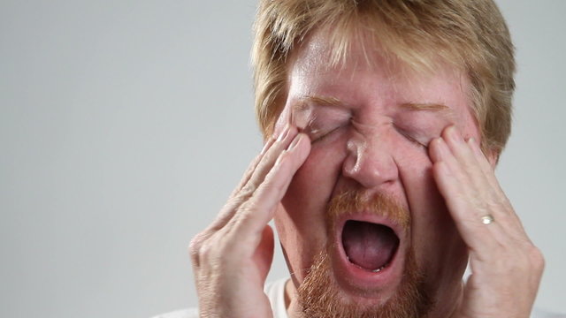 Man Yawns