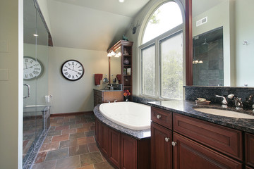 Master bath with multicolored flooring
