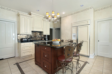 Kitchen with wood and granite island