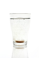 Fizzy tablet in a glass of water