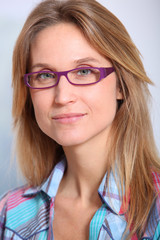 Closeup of beautiful blond woman wearing eyeglasses