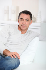 Closeup of handsome man relaxing in sofa