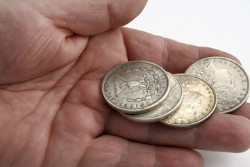 hand with dollar coins