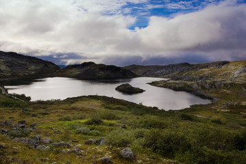Mountain lake on the ridge Musta Tunturi, Arctic Russia