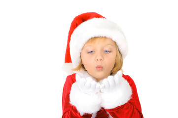 Cute little Santa Claus is blowing snowflake