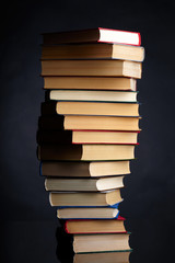 Pile of books on a black background