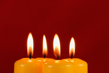 Fototapeta na wymiar Burning yellow candles