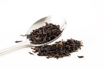 Tea leaves, a teaspoon