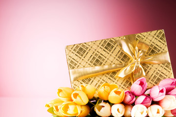 Obraz na płótnie Canvas Celebration concept - gift box and tulip flowers