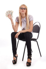 Fototapeta premium Businesswoman with money on office chair